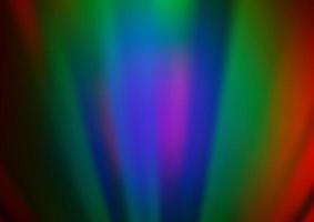dunkle mehrfarbige, regenbogenfarbene Vektorzusammenfassung der Hintergrund jedoch unscharf. vektor