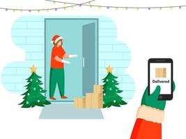 Santa liefern Paket beim Tür mit Handy, Mobiltelefon verifiziert im Vorderseite von Kunde Frau während Coronavirus Ausbruch.