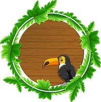 runde grüne Blätterfahnenschablone mit einer Tukan-Zeichentrickfigur vektor