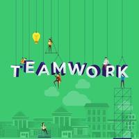 Team hart bei der Arbeit das Wort Teamwork zu konstruieren