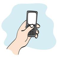 närbild hand innehav retro mobil telefon illustration vektor hand dragen isolerat på vit bakgrund linje konst.