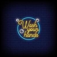 tvätta din hand neonskyltar stil text vektor