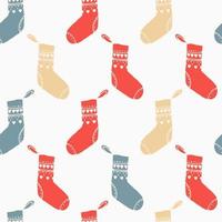 Weihnachten nahtlos Muster mit Socken Über das Kamin. hell fröhlich Weihnachten drucken rot und Blau vektor