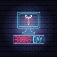 Boxing Day Sale Neonlichter mit Desktop und Geschenk vektor