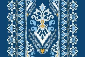 Ikat Blumen- Paisley Stickerei auf Blau hintergrund.ikat ethnisch orientalisch Muster traditionell.aztekisch Stil abstrakt Vektor illustration.design zum Textur, Stoff, Kleidung, Verpackung, Dekoration, Schal, Teppich.