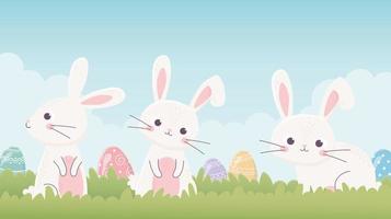 glad påsk söt kaniner med ägg i gräset vektor