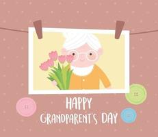glücklicher Großelterntag, hängendes Foto mit Oma, die Blumenkarikaturkarte hält vektor