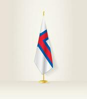 Färöer Inseln Flagge auf ein Flagge Stand. vektor