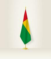 Guinea-Bissau Flagge auf ein Flagge Stand. vektor