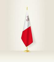 Malta Flagge auf ein Flagge Stand. vektor