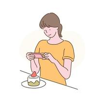 Eine Frau fotografiert mit ihrem Handy einen Kuchen. handgezeichnete Stilvektordesignillustrationen. vektor