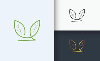 naturlig logotyp design gröna gyllene och svarta blad vektor