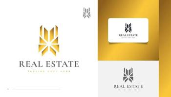 lyx guld fastigheter logotyp design med abstrakt koncept vektor