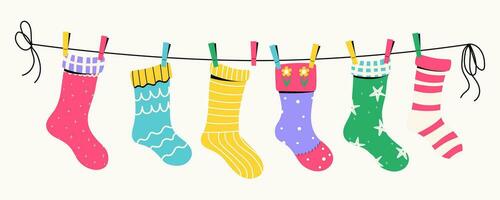 Baumwolle oder wolle Socken mit Texturen und Muster auf ein Wäscheleine mit Wäscheklammern. Vektor Illustration