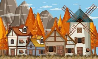 mittelalterliche Dorfszene mit Windmühle und Häusern vektor