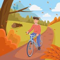 man cyklar under hösten