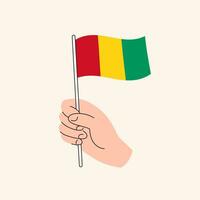 Karikatur Hand halten guineisch Flagge, isoliert Vektor Design.