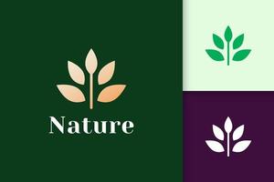 Blumenlogo im femininen und luxuriösen Stil für Gesundheit und Schönheit vektor