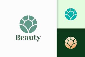 blomma logotyp i abstrakt form för hälsa och skönhet vektor