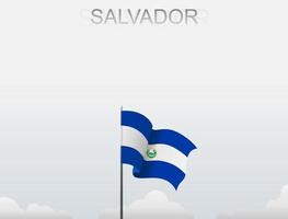 Salvadors flagga som flyger under den vita himlen vektor