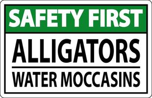 säkerhet först tecken alligatorer - vatten mockasiner vektor