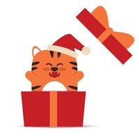 süße kleine orange Tigerkatze im flachen Stil. das symbol des chinesischen neuen jahres 2022. tier mit einer weihnachtsmütze in einer geschenkbox. für Banner, Kinderzimmerdekoration. Vektor-Illustration. vektor