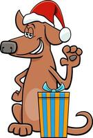 lustiger karikaturhund mit geschenk zur weihnachtszeit vektor