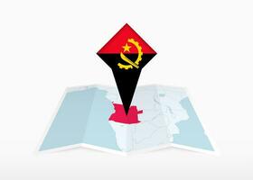 angola är avbildad på en vikta papper Karta och fästs plats markör med flagga av angola. vektor