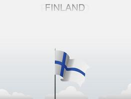die finnische flagge weht an einem mast, der hoch unter dem weißen himmel steht vektor