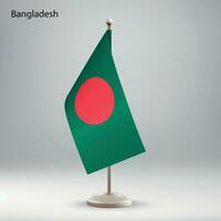 Flagge von Bangladesch hängend auf ein Flagge Stand. vektor