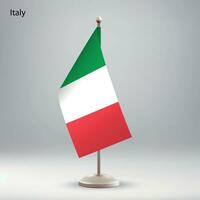 flagga av Italien hängande på en flagga stå. vektor