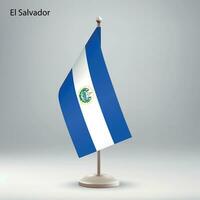 Flagge von el Salvador hängend auf ein Flagge Stand. vektor