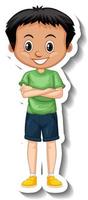 Ein Junge trägt ein grünes T-Shirt mit Cartoon-Charakter-Aufkleber vektor