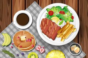 Steak mit Kaffee und Pfannkuchen auf dem Tisch vektor