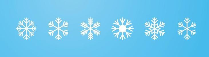 snöflinga ikonuppsättning, vit snöflinga på blå lutning