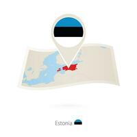 gefaltet Papier Karte von Estland mit Flagge Stift von Estland. vektor