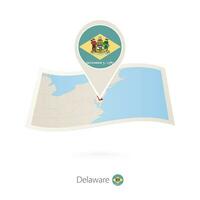 gefaltet Papier Karte von Delaware uns Zustand mit Flagge Stift von Delaware. vektor
