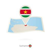 gefaltet Papier Karte von suriname mit Flagge Stift von Surinam. vektor
