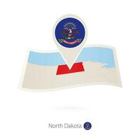 vikta papper Karta av norr dakota oss stat med flagga stift av norr dakota. vektor