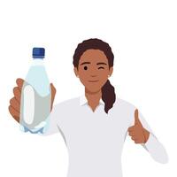 friska ung kvinna som visar flaska av mineral vatten och ge tumme upp vektor