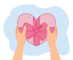 hand innehav gåva låda form hjärta för valentine dag vektor