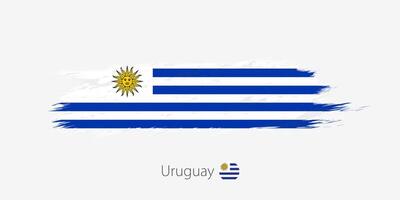 flagga av uruguay, grunge abstrakt borsta stroke på grå bakgrund. vektor