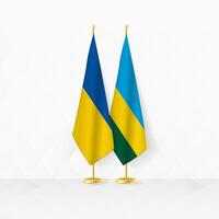 ukraina och rwanda flaggor på flagga stå, illustration för diplomati och Övrig möte mellan ukraina och rwanda. vektor