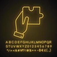 Lösungssymbol für Neonlicht finden. Probleme lösen. Zusammenarbeit. Hand hält Puzzle. leuchtendes Schild mit Alphabet, Zahlen und Symbolen. isolierte Vektorgrafik vektor