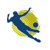 silhuett av en manlig fotboll spelare sparkar en boll. silhuett av en fotboll spelare i verkan utgör. vektor