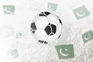 nationell fotboll team av pakistan gjorde mål mål. boll i mål netto, medan fotboll supportrar är vinka de pakistan flagga i de bakgrund. vektor