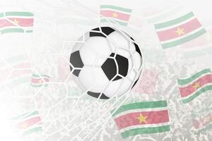 National Fußball Mannschaft von suriname erzielte Ziel. Ball im Tor Netz, während Fußball Unterstützer sind winken das suriname Flagge im das Hintergrund. vektor