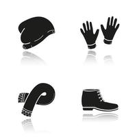 Winterkleidung Schlagschatten schwarze Symbole gesetzt. Skimütze, Handschuhe, Schal, Stiefel. isolierte vektorillustrationen vektor