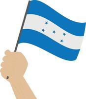 Hand halten und erziehen das National Flagge von Honduras vektor