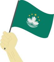 Hand halten und erziehen das National Flagge von Macao vektor